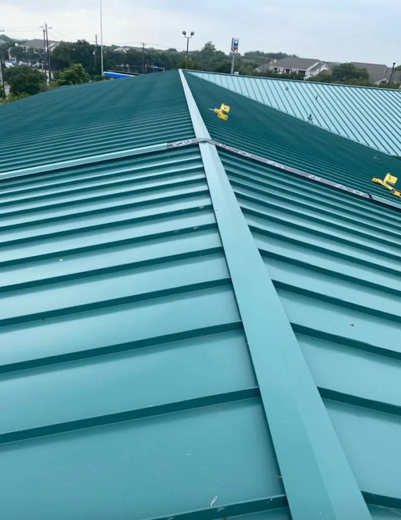 Green commercial metal roof ridge and valley for Metal Roof Repair in Pittsfield
